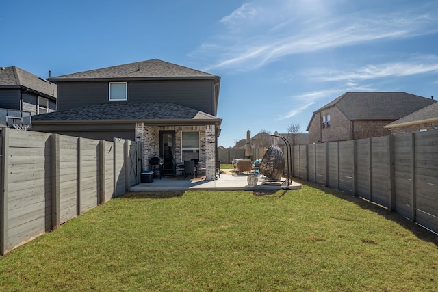 view of yard featuring a patio area and a fenced backyard