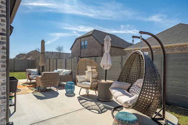 view of patio / terrace featuring an outdoor hangout area and a fenced backyard