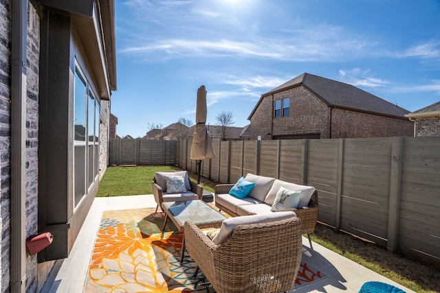 view of patio / terrace featuring a fenced backyard and an outdoor living space