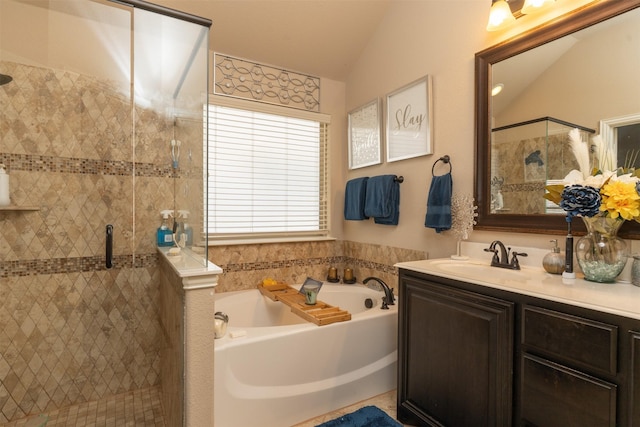 full bath with vaulted ceiling, a stall shower, vanity, and a bath