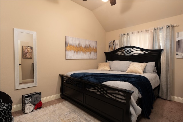 bedroom featuring lofted ceiling, ceiling fan, light carpet, and baseboards