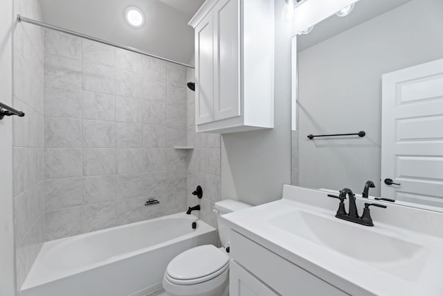 full bathroom featuring tub / shower combination, vanity, and toilet