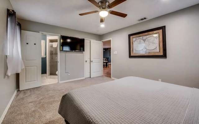 bedroom with visible vents, light carpet, connected bathroom, ceiling fan, and baseboards