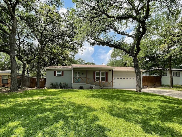 ranch-style house with fence, a front lawn, a garage, a porch, and concrete driveway