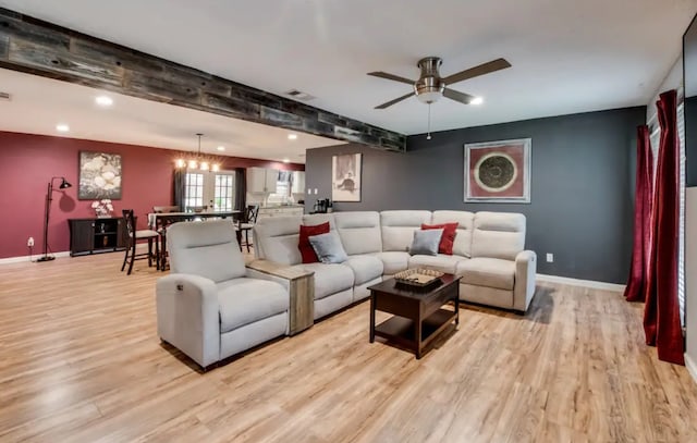 living area featuring recessed lighting, baseboards, and light wood finished floors