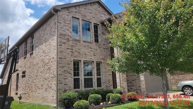 view of property exterior with brick siding