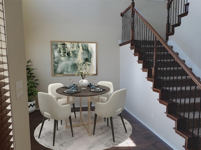 dining room featuring stairway, baseboards, and wood finished floors