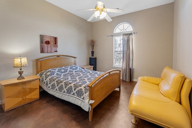 bedroom with ceiling fan and finished concrete floors