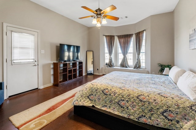 bedroom featuring visible vents, a ceiling fan, and baseboards