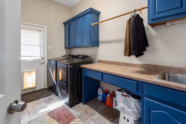 laundry room featuring cabinet space and washer and clothes dryer