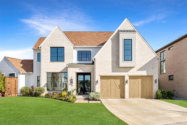 view of front of property featuring driveway, an attached garage, fence, a front yard, and brick siding
