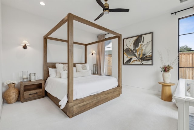 carpeted bedroom with a ceiling fan, visible vents, and recessed lighting