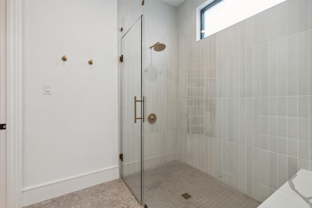 full bath with tiled shower