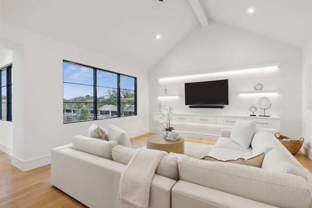 living area with beamed ceiling, light wood-style flooring, high vaulted ceiling, and recessed lighting