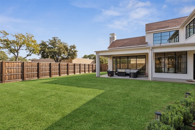 view of yard with a fenced backyard, an outdoor living space, and a patio area
