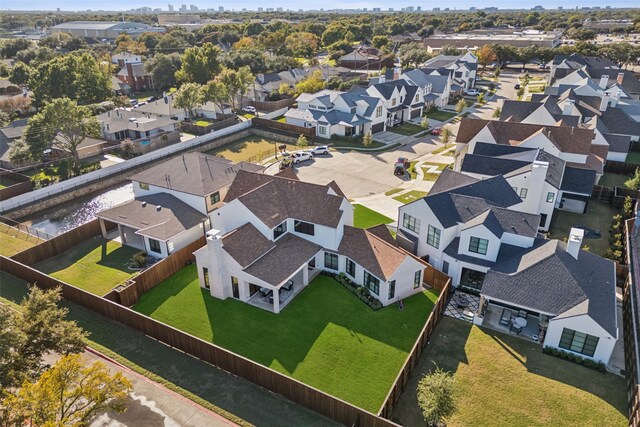 birds eye view of property with a residential view