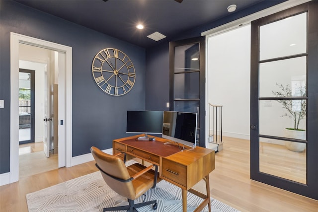 office area with recessed lighting, baseboards, and light wood-style flooring