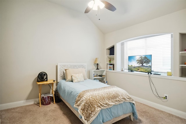 bedroom featuring lofted ceiling, baseboards, and carpet floors