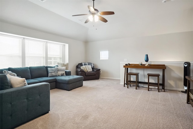 living room featuring vaulted ceiling, ceiling fan, baseboards, and carpet floors