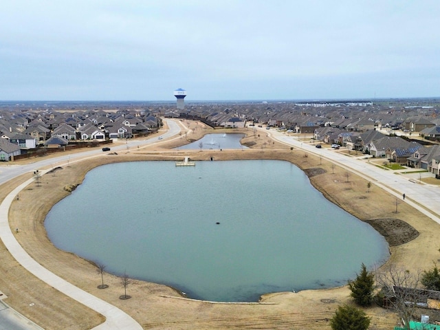 drone / aerial view with a residential view and a water view