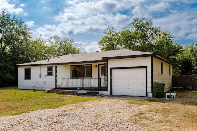 ranch-style home with a porch, a front yard, fence, a garage, and driveway