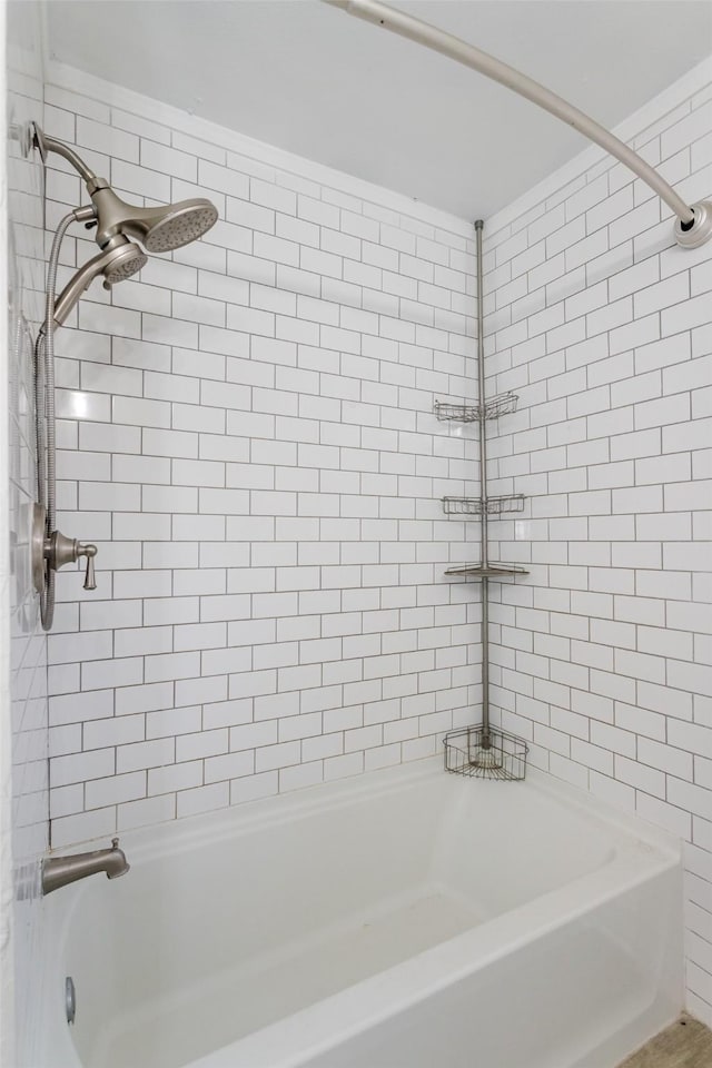 bathroom with washtub / shower combination