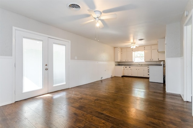 kitchen featuring dark wood-style floors, white cabinetry, visible vents, and french doors