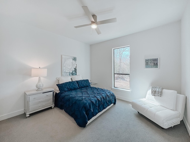 bedroom with ceiling fan, carpet floors, and baseboards