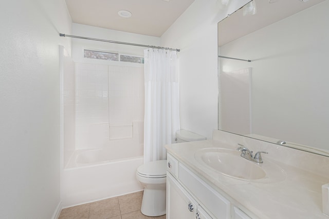 bathroom featuring tile patterned flooring, vanity, toilet, and shower / bath combo with shower curtain