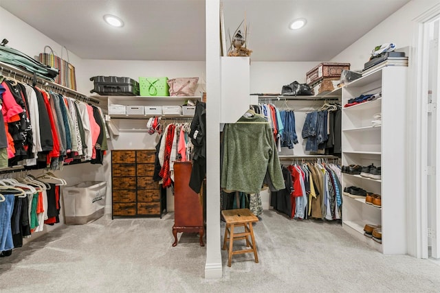 walk in closet featuring carpet floors