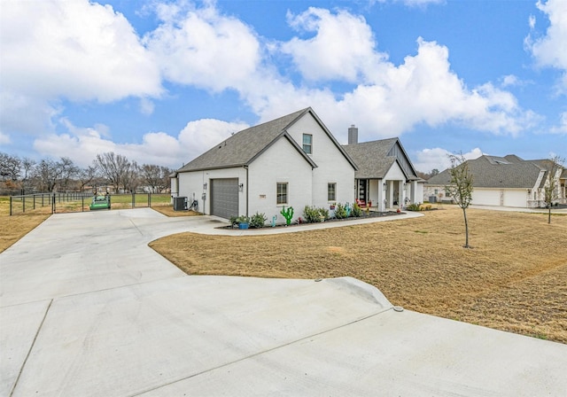 modern farmhouse featuring central AC unit, a chimney, and fence