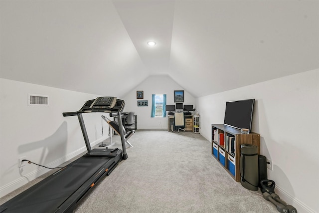 exercise area with vaulted ceiling, carpet flooring, visible vents, and baseboards