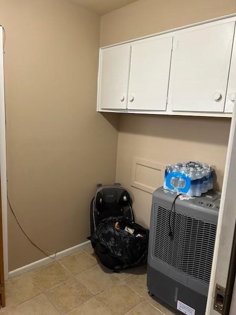 909 Harwell St, Abilene, TX 79601 - washroom featuring baseboards and light tile patterned floors