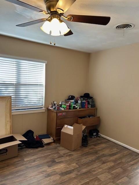 909 Harwell St, Abilene, TX 79601 - interior space with baseboards, visible vents, ceiling fan, and wood finished floors
