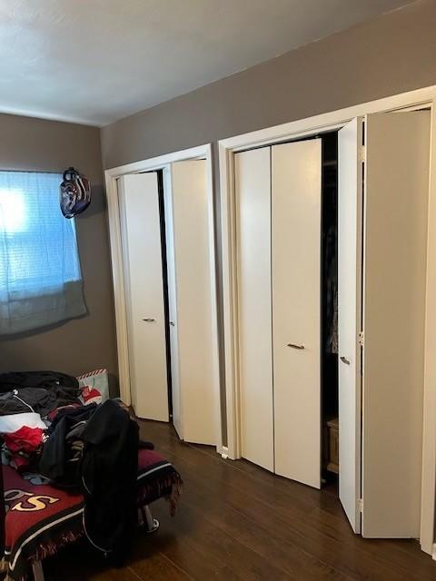 909 Harwell St, Abilene, TX 79601 - bedroom with dark wood finished floors and two closets