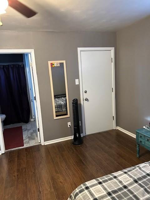 909 Harwell St, Abilene, TX 79601 - unfurnished bedroom with baseboards and wood finished floors