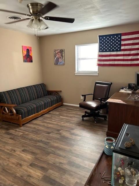 909 Harwell St, Abilene, TX 79601 - living room featuring a ceiling fan, visible vents, baseboards, and wood finished floors