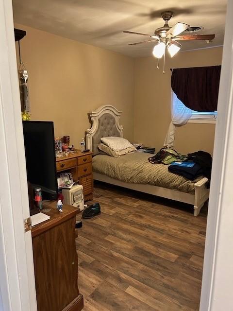 909 Harwell St, Abilene, TX 79601 - bedroom with a ceiling fan and wood finished floors