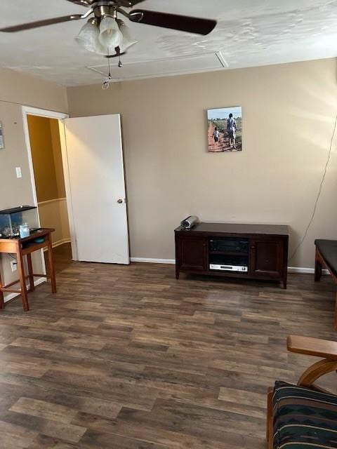 909 Harwell St, Abilene, TX 79601 - living area featuring dark wood-type flooring, ceiling fan, and baseboards