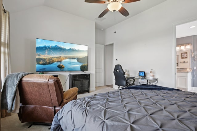 bedroom featuring high vaulted ceiling, light colored carpet, ceiling fan, and ensuite bath