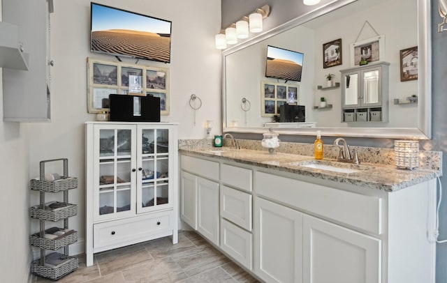 bathroom featuring double vanity and a sink