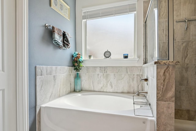 full bathroom featuring a walk in shower and a bath