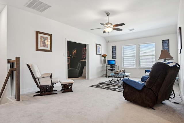 sitting room featuring ceiling fan, carpet, an upstairs landing, and visible vents