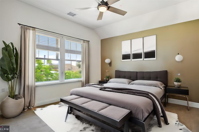 bedroom with visible vents, vaulted ceiling, and baseboards