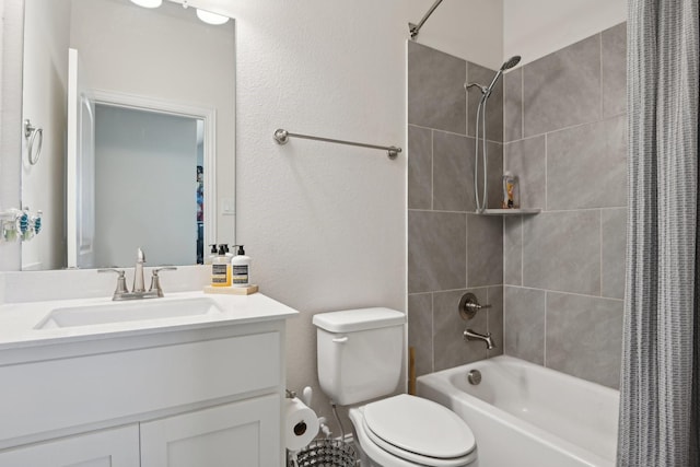 bathroom with toilet, shower / tub combo, and vanity