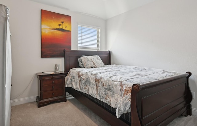 bedroom featuring carpet and baseboards