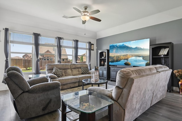 living area with dark wood finished floors and a ceiling fan