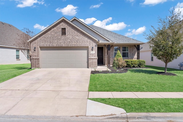 view of front of home featuring driveway, brick siding, a shingled roof, an attached garage, and a front yard