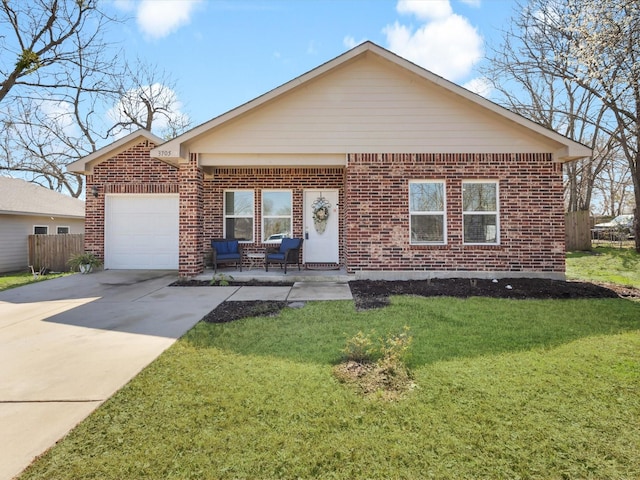 view of front of home with a front yard, an attached garage, fence, and brick siding