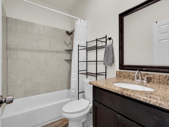 full bathroom featuring vanity, toilet, wood finished floors, and shower / bath combo with shower curtain